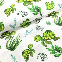 Tela de algodón estampado con tortugas marinas verdes y plantas | Telas Lobo
